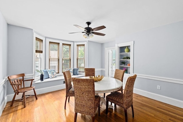 225 Pleasant St, Weymouth, MA 02190 - dining room featuring light wood-type flooring, a ceiling fan, and baseboards
