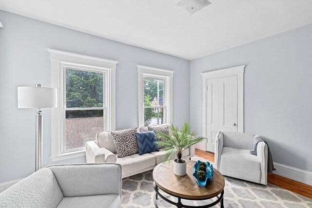 225 Pleasant St, Weymouth, MA 02190 - living room featuring light wood-type flooring and baseboards