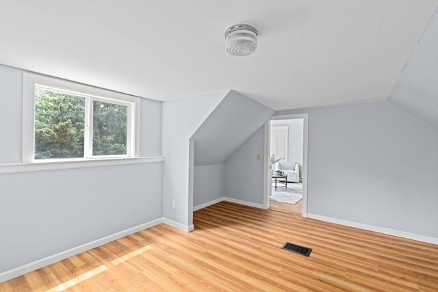 225 Pleasant St, Weymouth, MA 02190 - additional living space featuring light wood-style flooring, vaulted ceiling, and baseboards
