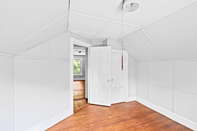 225 Pleasant St, Weymouth, MA 02190 - bonus room featuring a decorative wall, wood-type flooring, and lofted ceiling