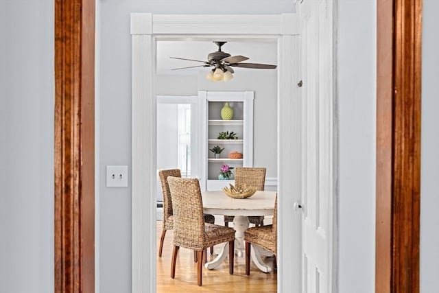 225 Pleasant St, Weymouth, MA 02190 - dining space with a ceiling fan and light wood-style floors