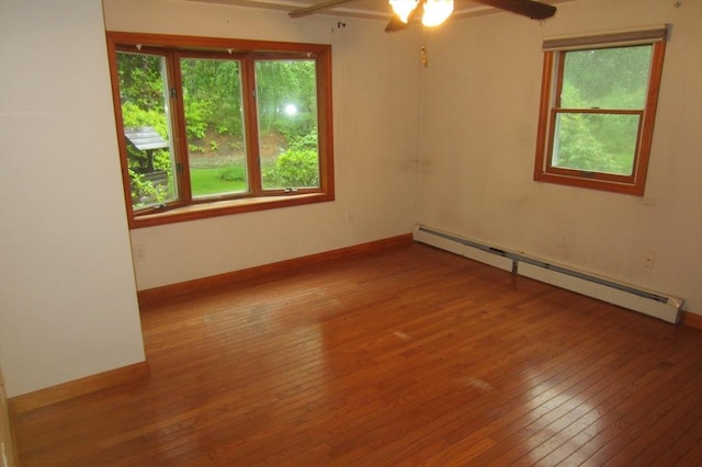 30 Bailey Rd, Oxford, MA 01540 - spare room with a baseboard radiator, hardwood / wood-style floors, healthy amount of natural light, and a ceiling fan