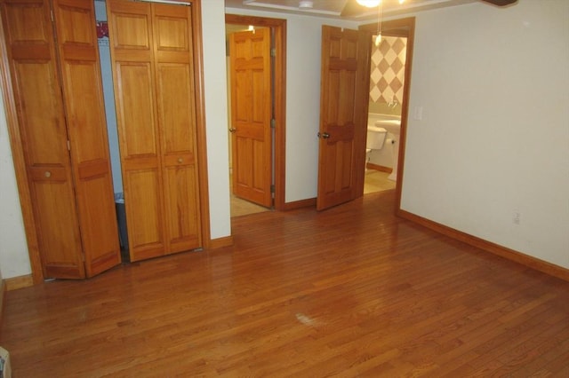 30 Bailey Rd, Oxford, MA 01540 - unfurnished bedroom with light wood finished floors, baseboards, and connected bathroom