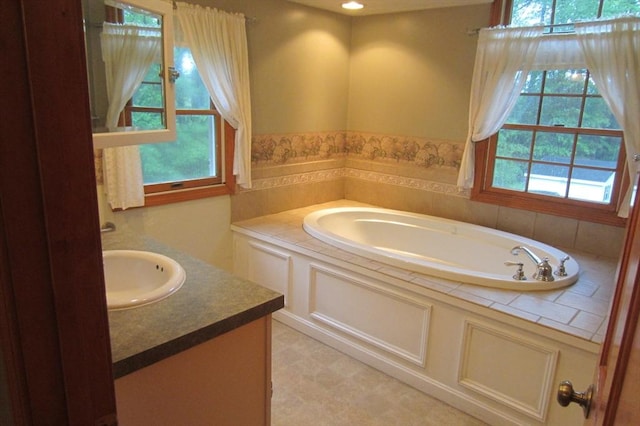 30 Bailey Rd, Oxford, MA 01540 - bathroom featuring a garden tub, vanity, and tile patterned floors