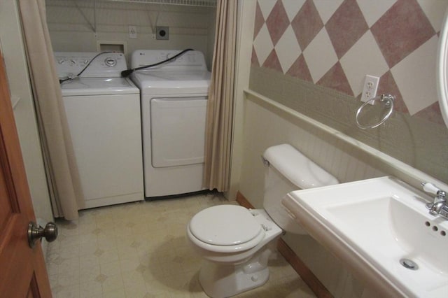 30 Bailey Rd, Oxford, MA 01540 - bathroom featuring washer and dryer, toilet, a sink, and tile patterned floors