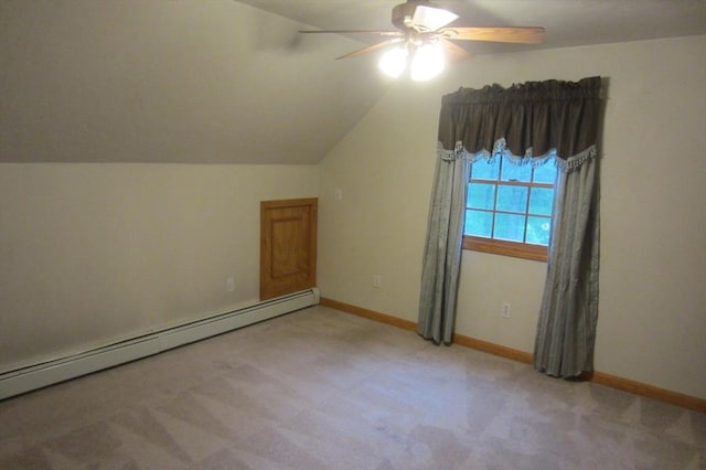 30 Bailey Rd, Oxford, MA 01540 - additional living space with a baseboard heating unit, ceiling fan, light colored carpet, vaulted ceiling, and baseboards