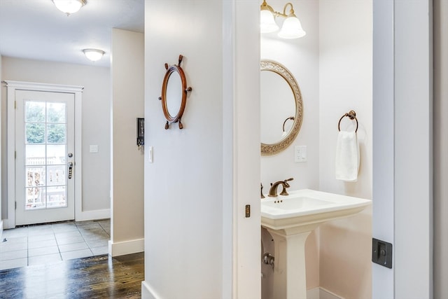 bathroom with hardwood / wood-style floors