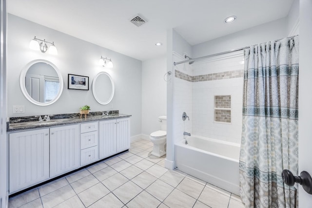 full bathroom featuring tile patterned flooring, vanity, shower / bath combo, and toilet