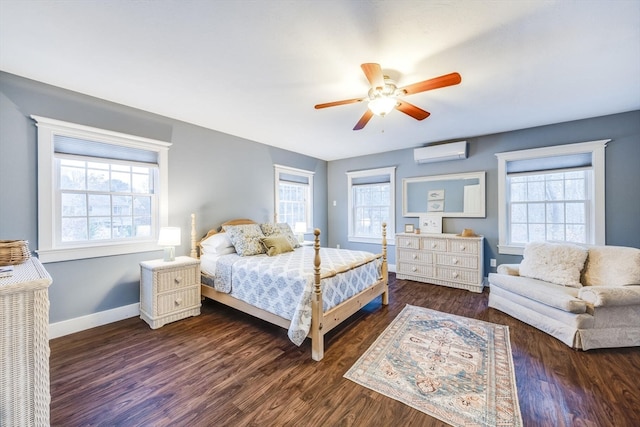 bedroom with a wall mounted AC, ceiling fan, and multiple windows