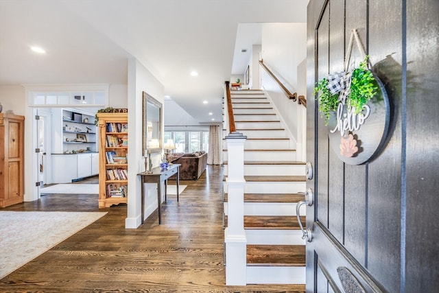 entrance foyer with dark hardwood / wood-style floors