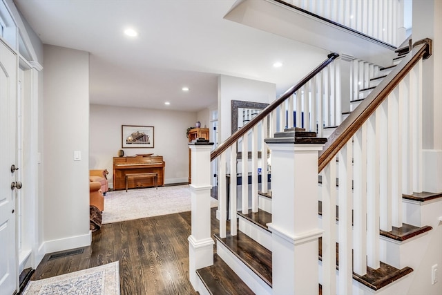 stairs with wood-type flooring