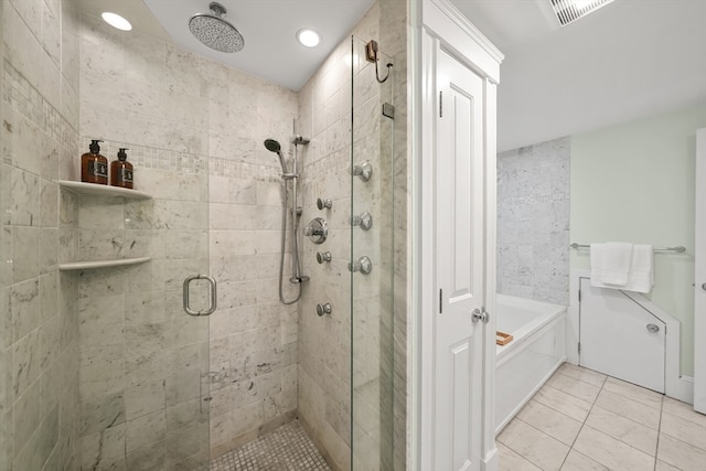 bathroom featuring plus walk in shower and tile patterned flooring