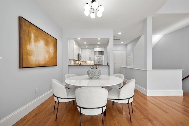 dining area featuring light wood-type flooring