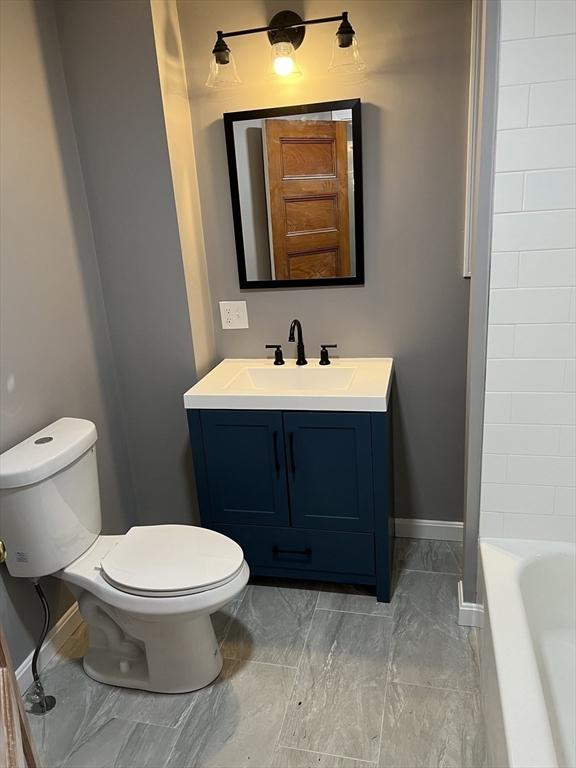 bathroom with toilet and vanity