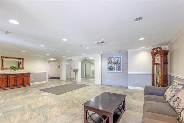 living room featuring arched walkways, ornamental molding, and recessed lighting