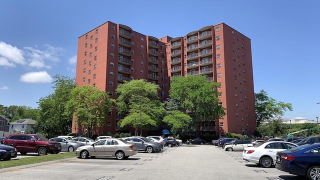 view of property featuring uncovered parking