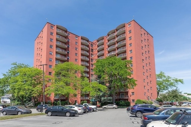 view of property featuring uncovered parking