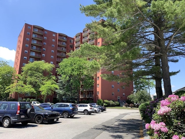 view of property featuring uncovered parking