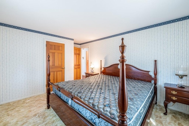 carpeted bedroom featuring wallpapered walls and baseboards