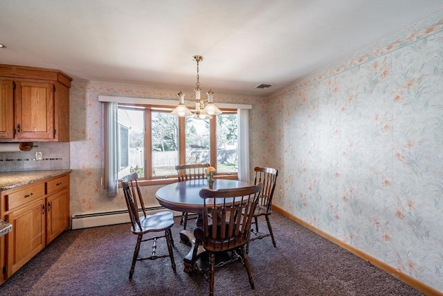 dining area with dark colored carpet, baseboards, wallpapered walls, a baseboard heating unit, and an inviting chandelier