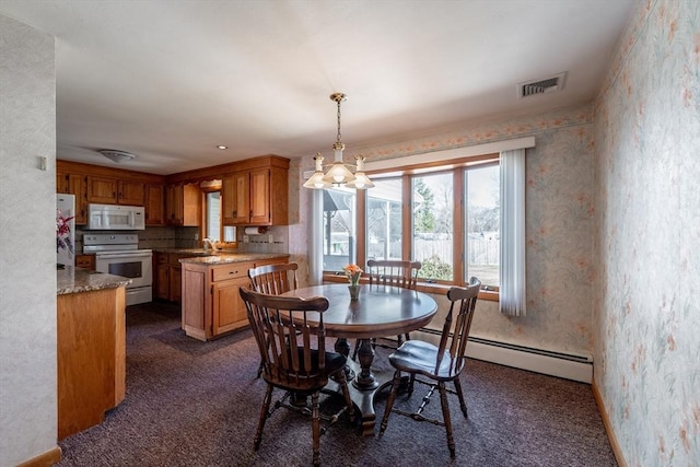 dining area featuring an inviting chandelier, wallpapered walls, dark carpet, visible vents, and a baseboard radiator