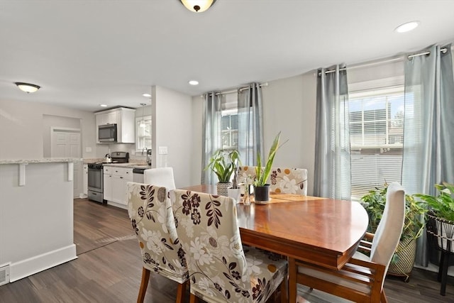 dining area with recessed lighting, dark wood-style flooring, and a wealth of natural light