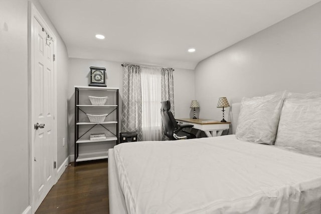 bedroom with recessed lighting and wood finished floors