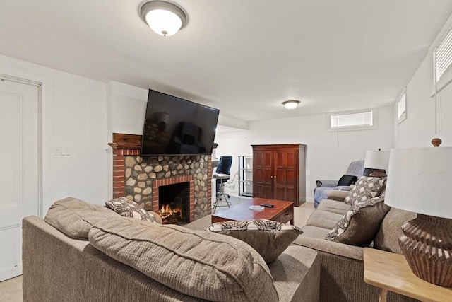 living area featuring visible vents and a fireplace