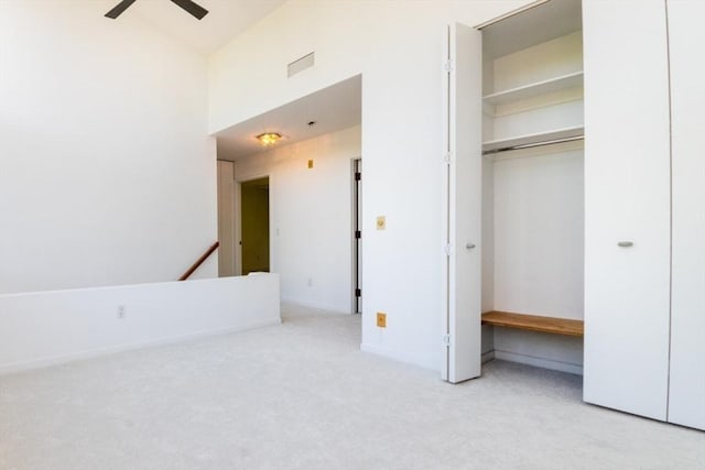 241 Perkins St Unit J602, Boston, MA 02130 - unfurnished bedroom featuring carpet floors, a closet, a towering ceiling, and baseboards