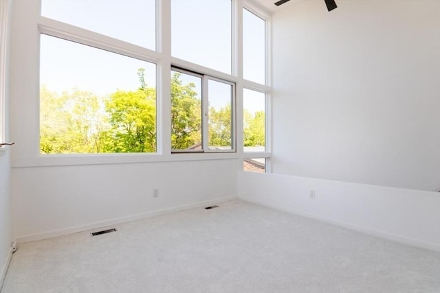 241 Perkins St Unit J602, Boston, MA 02130 - spare room with plenty of natural light, carpet floors, a ceiling fan, and baseboards