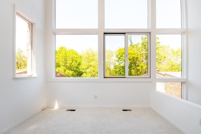 241 Perkins St Unit J602, Boston, MA 02130 - carpeted spare room featuring baseboards and a high ceiling
