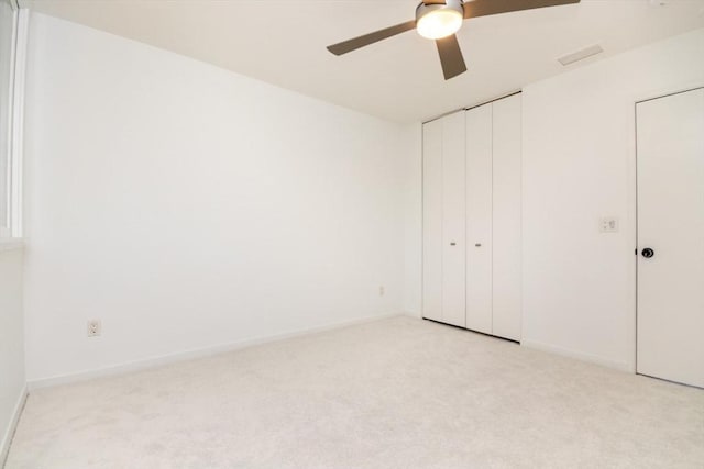 241 Perkins St Unit J602, Boston, MA 02130 - unfurnished bedroom with light colored carpet, a closet, baseboards, and ceiling fan