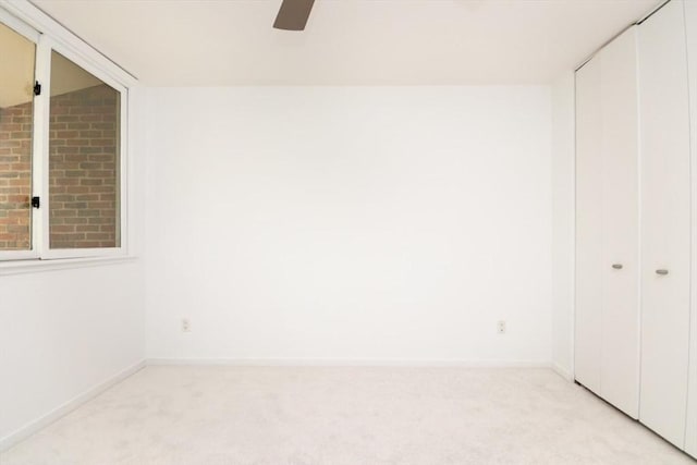 241 Perkins St Unit J602, Boston, MA 02130 - unfurnished bedroom with light carpet, a closet, baseboards, and ceiling fan