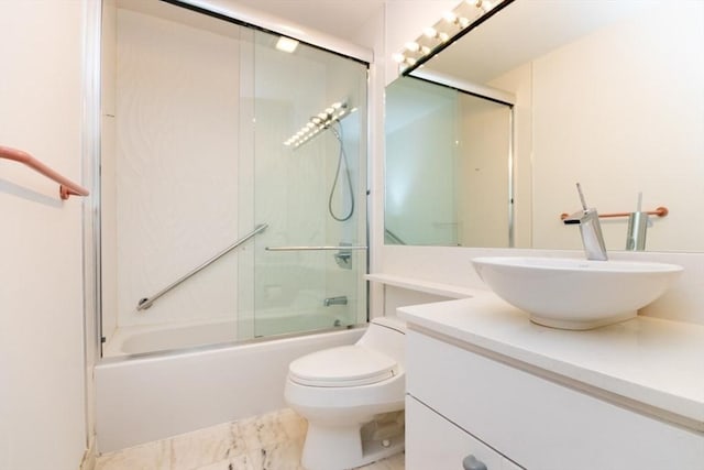 241 Perkins St Unit J602, Boston, MA 02130 - bathroom featuring vanity, shower / bath combination with glass door, toilet, and marble look tile flooring