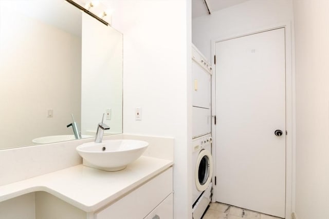 241 Perkins St Unit J602, Boston, MA 02130 - bathroom featuring stacked washer / drying machine and vanity
