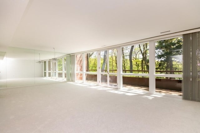241 Perkins St Unit J602, Boston, MA 02130 - carpeted empty room with healthy amount of natural light