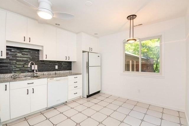 241 Perkins St Unit J602, Boston, MA 02130 - kitchen featuring white appliances, a sink, light floors, backsplash, and white cabinetry