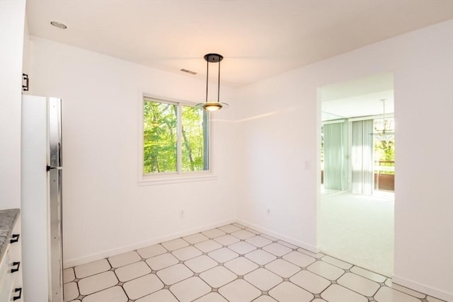 241 Perkins St Unit J602, Boston, MA 02130 - unfurnished dining area featuring light floors and baseboards