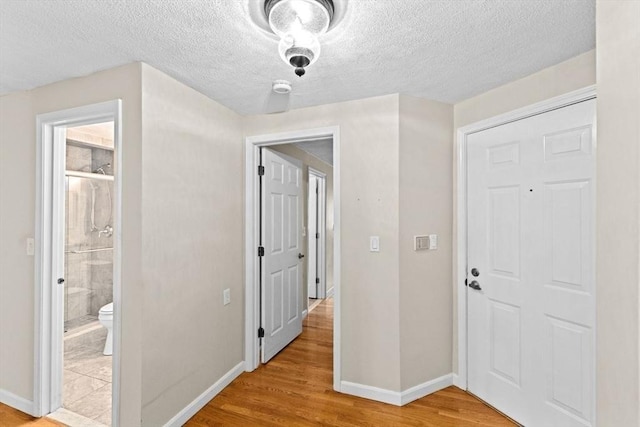225 Lincoln St Unit G3, Duxbury, MA 02332 - corridor with light wood-style flooring and a textured ceiling