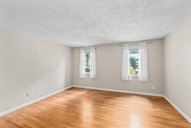 225 Lincoln St Unit G3, Duxbury, MA 02332 - empty room featuring light wood finished floors and a textured ceiling