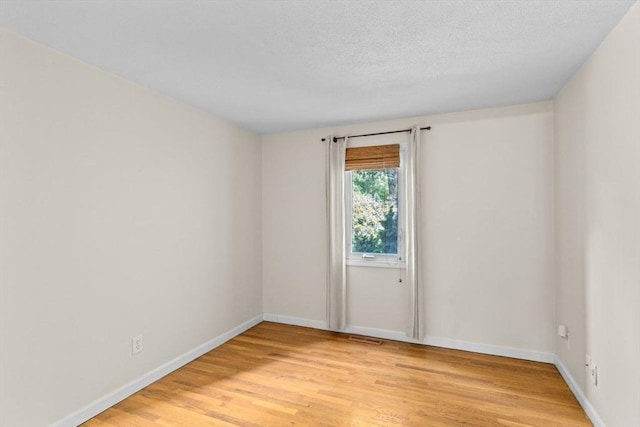 225 Lincoln St Unit G3, Duxbury, MA 02332 - unfurnished room featuring light wood-type flooring and a textured ceiling