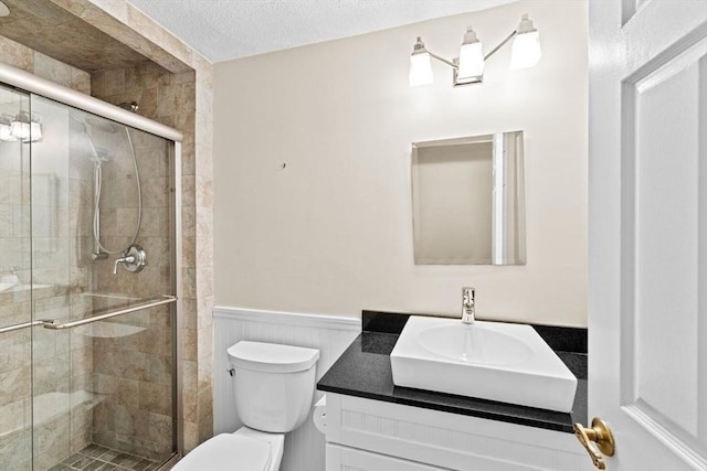 225 Lincoln St Unit G3, Duxbury, MA 02332 - full bath with vanity, wainscoting, a shower stall, and a textured ceiling
