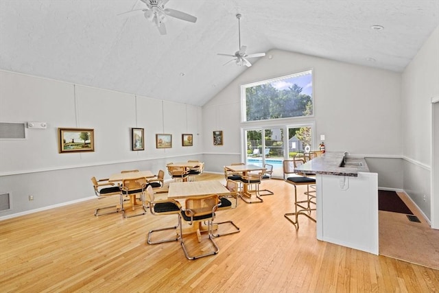 225 Lincoln St Unit G3, Duxbury, MA 02332 - dining area with high vaulted ceiling, ceiling fan, and wood finished floors
