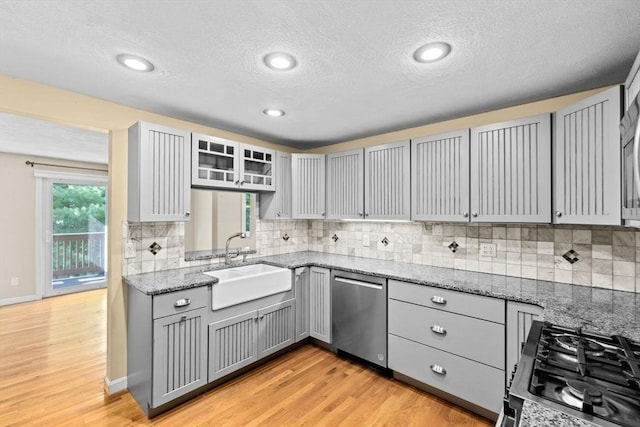 225 Lincoln St Unit G3, Duxbury, MA 02332 - kitchen with dishwasher, gray cabinetry, a textured ceiling, light stone counters, and light wood-style floors