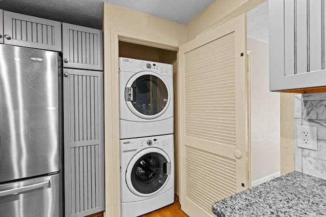 225 Lincoln St Unit G3, Duxbury, MA 02332 - washroom featuring stacked washing machine and dryer