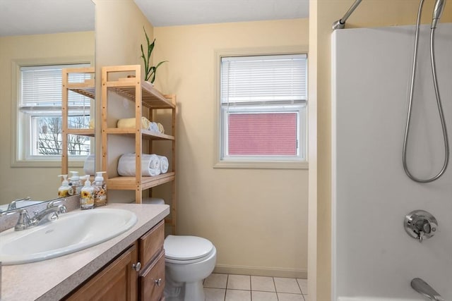 full bathroom with vanity, tile patterned floors, washtub / shower combination, and toilet