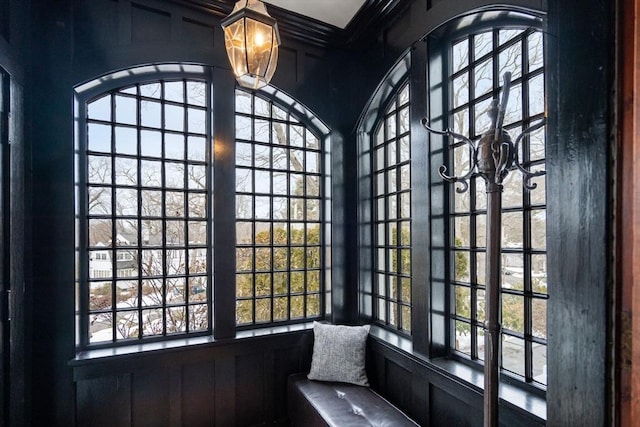 interior space featuring a wealth of natural light and a decorative wall