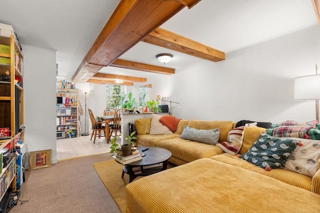 living room featuring beam ceiling, light carpet, and light tile patterned floors