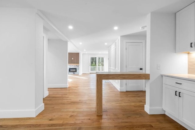 corridor featuring light hardwood / wood-style floors