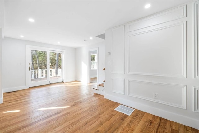 unfurnished room with light hardwood / wood-style flooring